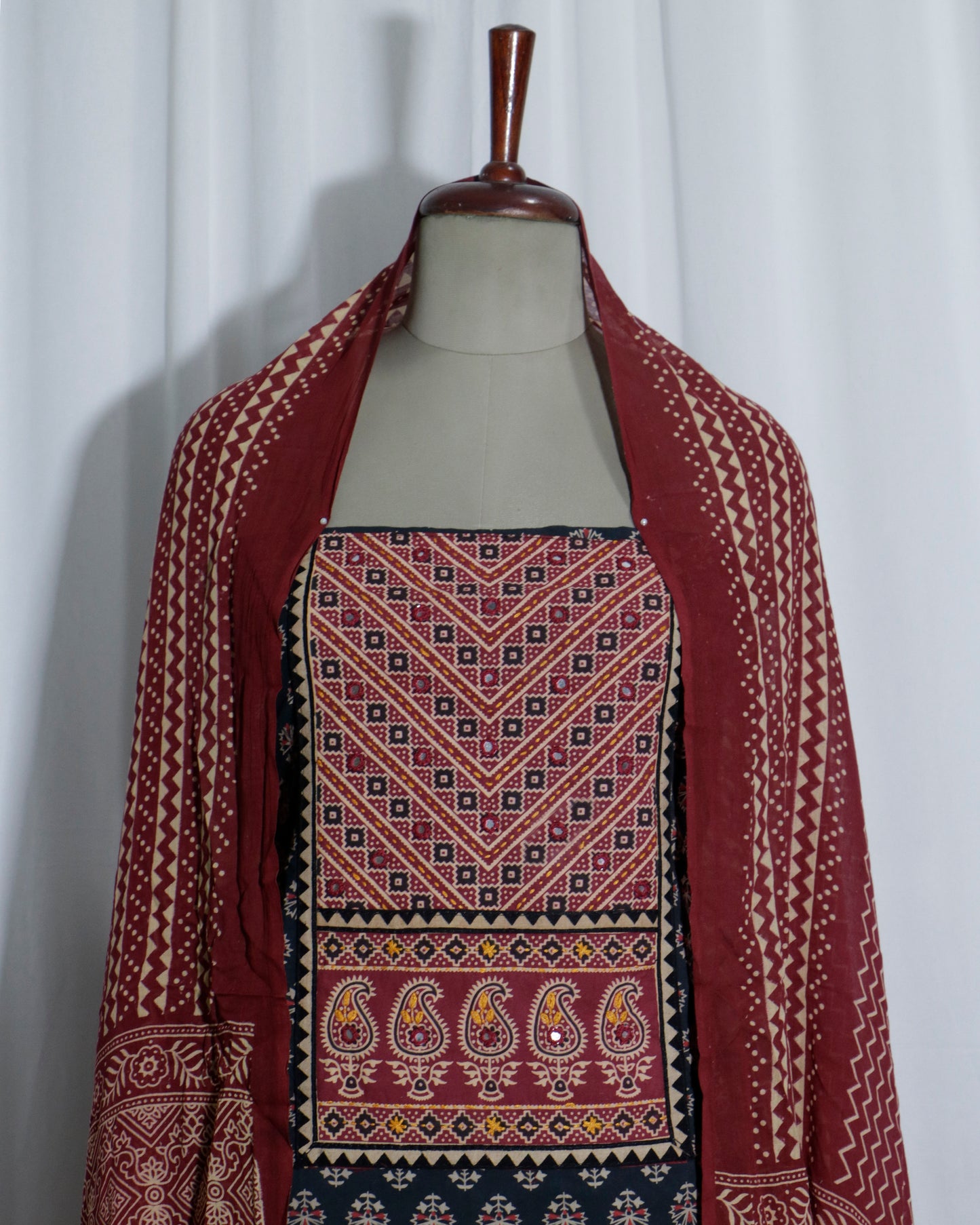 Mirror worked Ajrakh Handprinted cotton Suit set with mul-mul dupatta