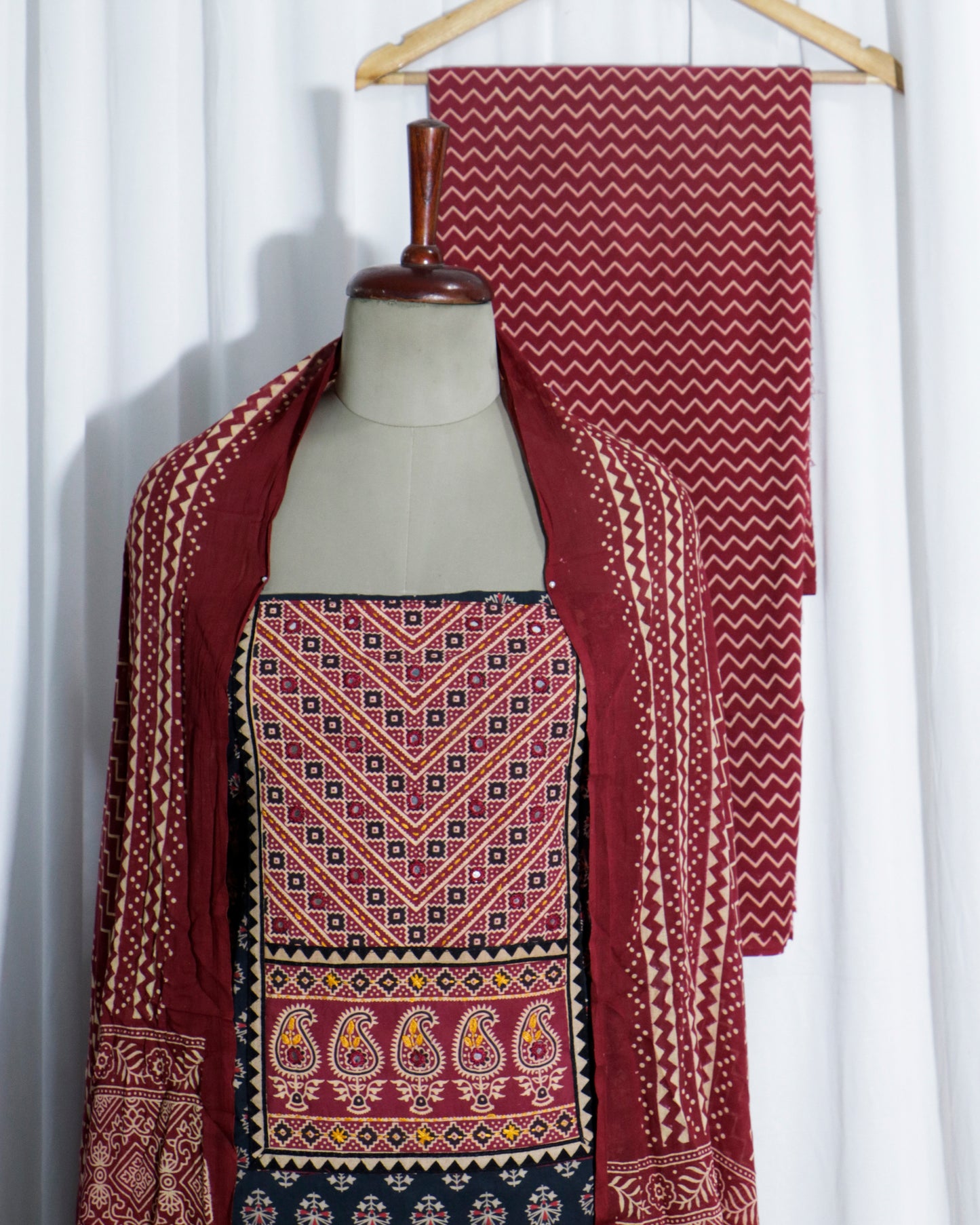 Mirror worked Ajrakh Handprinted cotton Suit set with mul-mul dupatta