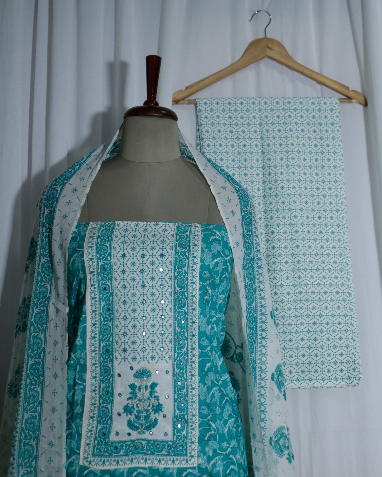 Printed Sea green Cotton suit set with Hand detailing on Neck Yoke